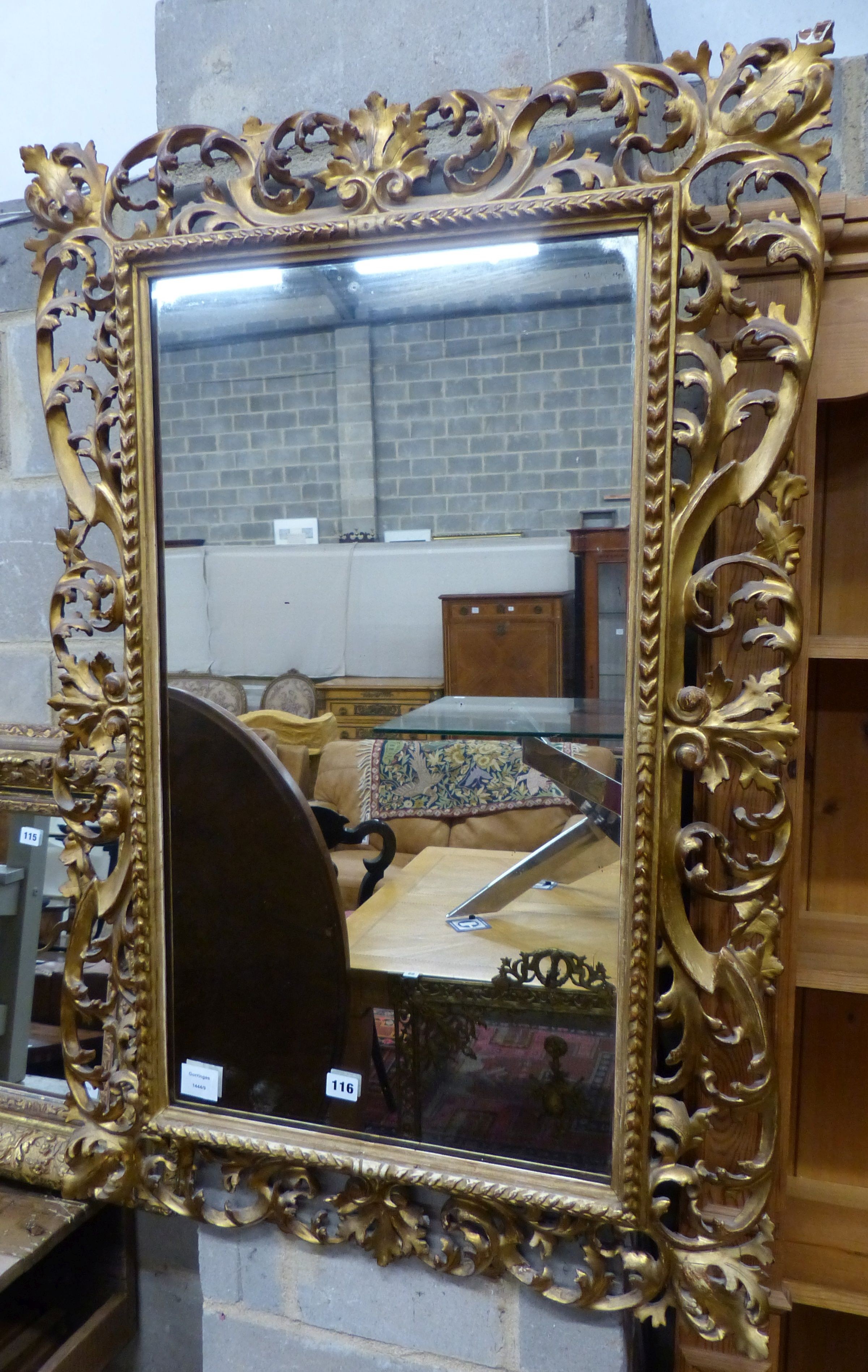 A 19th century Florentine carved gilt wood wall mirror, W.72cm H.108cm